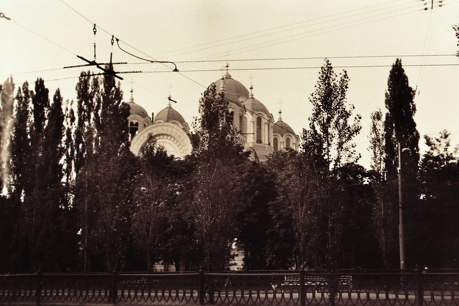Clasped hands resting on a parapet above the Dnieper valley