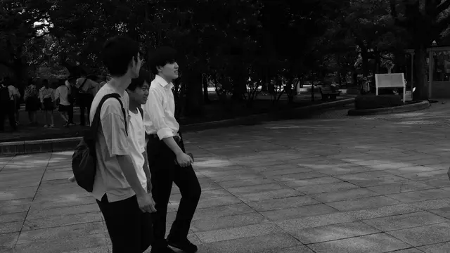 Three friends crossing the Peace Memorial Park