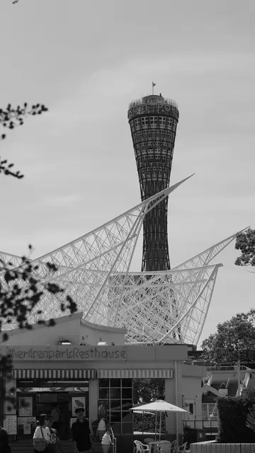 Kobe Port Tower behind the Maritime Museum sails