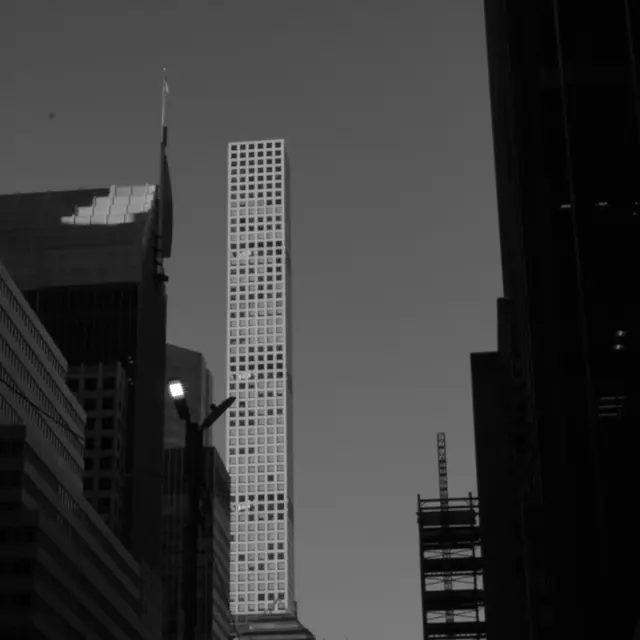 432 Park Avenue catching the light between dark towers