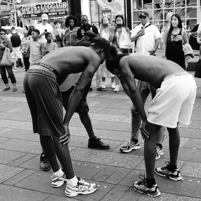 Street performers stretching head to head in Times Square