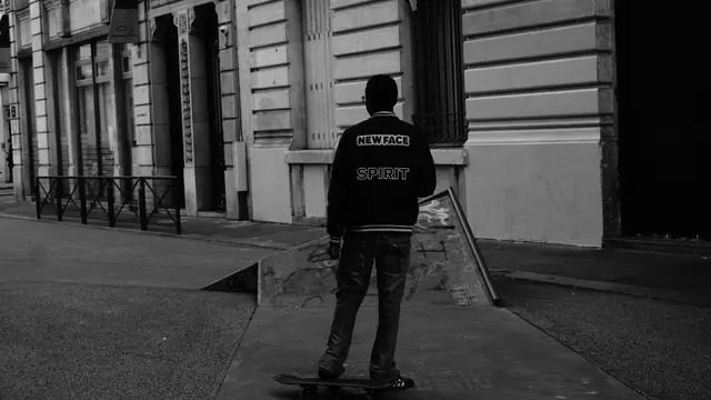 Skater in a New Face Spirit jacket, seen from behind