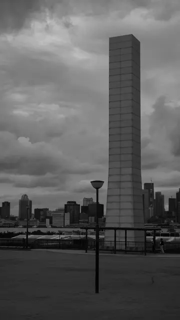 Monolith against a stormy sky over Tokyo Bay