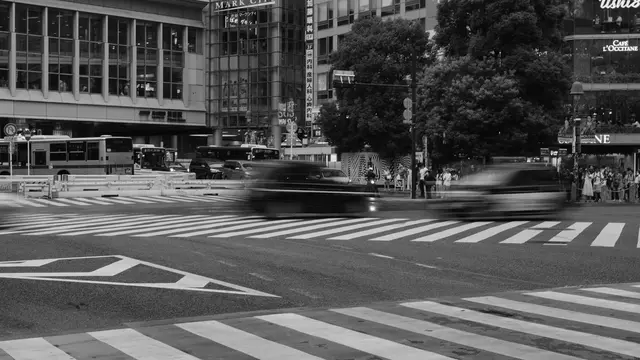 Traffic blur across the Shibuya scramble